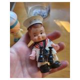 Nautical Decor Lot with Sailor Dolls, Blue Ship Jar, and Large Seashell