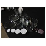 Collection of Pampered Chef Glass Mixing Bowls, Pie Plates, and Storage Lids