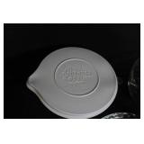 Collection of Pampered Chef Glass Mixing Bowls, Pie Plates, and Storage Lids