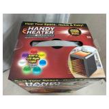 New Handy Heater Pure Warmth Ceramic Space Heater with LED Lights
