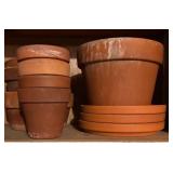 G  - Collection of Mixed Clay and Plastic Flower Pots and Saucers