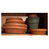 G  - Collection of Mixed Clay and Plastic Flower Pots and Saucers