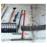 G - Assorted Yard and Snow Tools Including Pruner, Shovel, Brooms, and Snow Pushers
