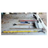 G - Assorted Yard and Snow Tools Including Pruner, Shovel, Brooms, and Snow Pushers