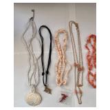 Collection of 7 Vintage Beaded and Shell Necklaces with Religious and Animal Charms