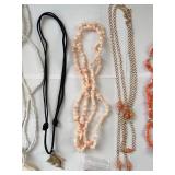 Collection of 7 Vintage Beaded and Shell Necklaces with Religious and Animal Charms