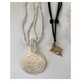 Collection of 7 Vintage Beaded and Shell Necklaces with Religious and Animal Charms