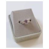 Elegant Ring with Purple Gemstone and Clear Stones