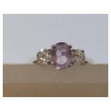 Elegant Ring with Purple Gemstone and Clear Stones