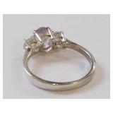 Elegant Ring with Purple Gemstone and Clear Stones