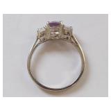Elegant Ring with Purple Gemstone and Clear Stones