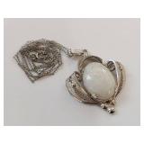 Elegant Silver Necklace with Intricate White Opal Pendant