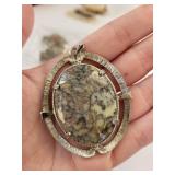 Collection of Vintage Agate, Shell Cameo, Dinosaur Bone Pendant, Mother of Pearl, and Carnelian Jewelry Brooches and Pendants