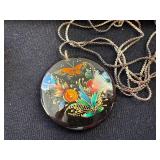 Folk Art Collection with Tooled Leather Pouch, Carved Dragon Box, Handpainted Medallion, and Guatemalan Worry Dolls