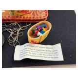 Folk Art Collection with Tooled Leather Pouch, Carved Dragon Box, Handpainted Medallion, and Guatemalan Worry Dolls