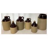 Collection of Single Handle Whiskey Jugs, Pair of Crock Jugs and Pickling Crock