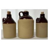 Collection of Single Handle Whiskey Jugs, Pair of Crock Jugs and Pickling Crock
