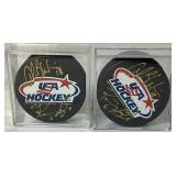USA Hockey Black Pucks Autographed by Alana Blahok #18 and Karen Bye #6
