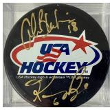 USA Hockey Black Pucks Autographed by Alana Blahok #18 and Karen Bye #6
