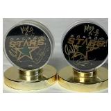 Pair of Dallas Stars Autographed Hockey Pucks 2000 - Mike Keane #12, Guy Carbonneau #21, Brett Hull and Jamie Wright