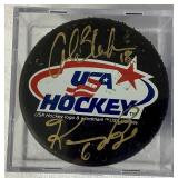 Bundle of 3 USA Hockey Black Pucks Autographed by Alana Blahok #18 and Karen Bye #6