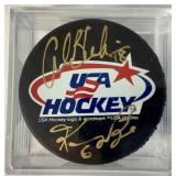 Bundle of 3 USA Hockey Black Pucks Autographed by Alana Blahok #18 and Karen Bye #6