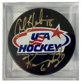 Bundle of 3 USA Hockey Black Pucks Autographed by Alana Blahok #18 and Karen Bye #6