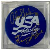 USA Hockey Blue Pucks Autographed by Alana Blahok #18 and Karen Bye #6