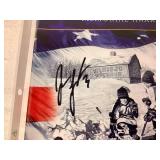 Jordan Leopold Autographed Hockey Puck and Autographed Hobey Baker Award Program April 12, 2002  - LOT 2