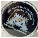 Jordan Leopold Autographed Hockey Puck and Autographed Hobey Baker Award Program April 12, 2002  - LOT 2
