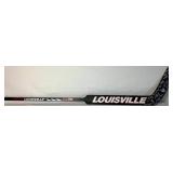 University of Minnesota Womans Hockey Goalie Stick Signed by Team Members and 2 Inaugural Game Pucks