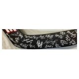 University of Minnesota Womans Hockey Goalie Stick Signed by Team Members and 2 Inaugural Game Pucks