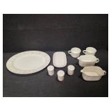 Pieces of the Mikasa Cobblestone dinnerware collection The collection includes a large oval serving platter, a smaller rectangular platter, two gravy boats (one larger, one smaller), three shakers (li