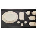 Pieces of the Mikasa Cobblestone dinnerware collection The collection includes a large oval serving platter, a smaller rectangular platter, two gravy boats (one larger, one smaller), three shakers (li