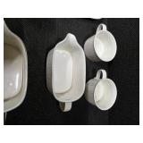 Pieces of the Mikasa Cobblestone dinnerware collection The collection includes a large oval serving platter, a smaller rectangular platter, two gravy boats (one larger, one smaller), three shakers (li