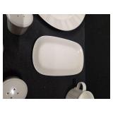 Pieces of the Mikasa Cobblestone dinnerware collection The collection includes a large oval serving platter, a smaller rectangular platter, two gravy boats (one larger, one smaller), three shakers (li