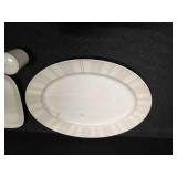 Pieces of the Mikasa Cobblestone dinnerware collection The collection includes a large oval serving platter, a smaller rectangular platter, two gravy boats (one larger, one smaller), three shakers (li