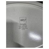 Pieces of the Mikasa Cobblestone dinnerware collection The collection includes a large oval serving platter, a smaller rectangular platter, two gravy boats (one larger, one smaller), three shakers (li