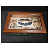 Wood Box With Shadow Box Lid filled with Fishing gear in it.