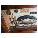 Wood Box With Shadow Box Lid filled with Fishing gear in it.