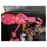 Tote full of 13 umbrellas