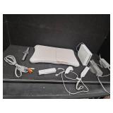 Nintendo Wii console with a Wii Balance Board and various accessories