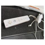 Nintendo Wii console with a Wii Balance Board and various accessories