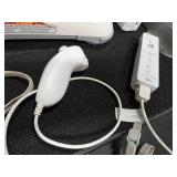 Nintendo Wii console with a Wii Balance Board and various accessories