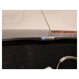 Nintendo Wii console with a Wii Balance Board and various accessories