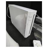 Nintendo Wii console with a Wii Balance Board and various accessories