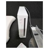 Nintendo Wii console with a Wii Balance Board and various accessories