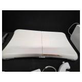 Nintendo Wii console with a Wii Balance Board and various accessories