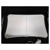 Nintendo Wii console with a Wii Balance Board and various accessories