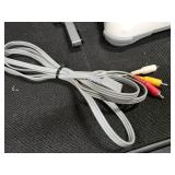 Nintendo Wii console with a Wii Balance Board and various accessories